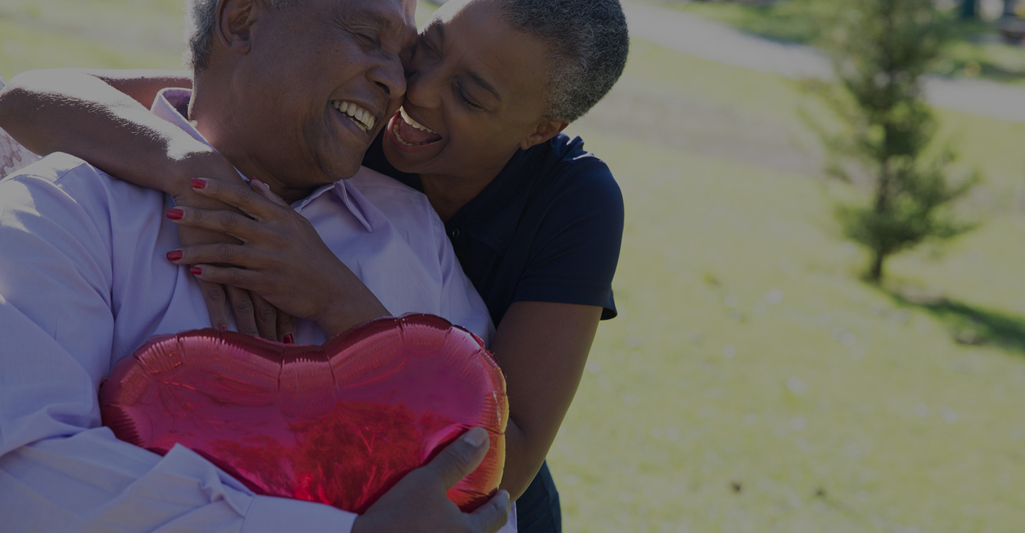 Couple embracing and smiling