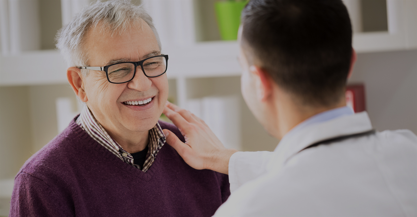 Patient talking with his doctor.