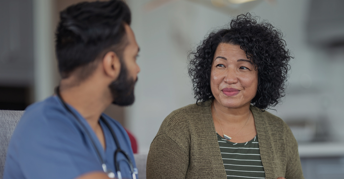 Woman talking with her doctor.