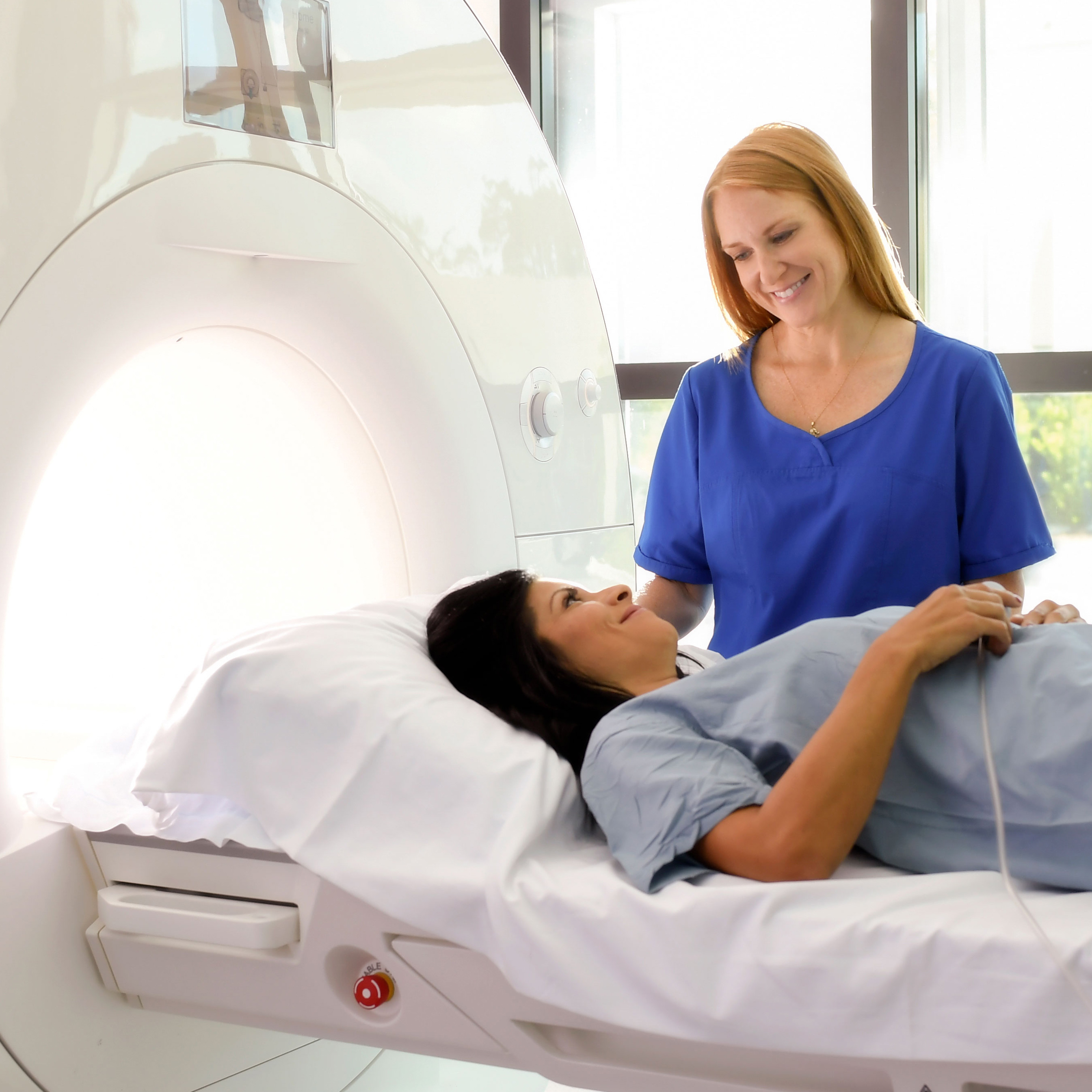 A woman prepares for an MRI.