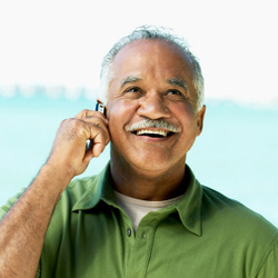 Mature man talking on phone.