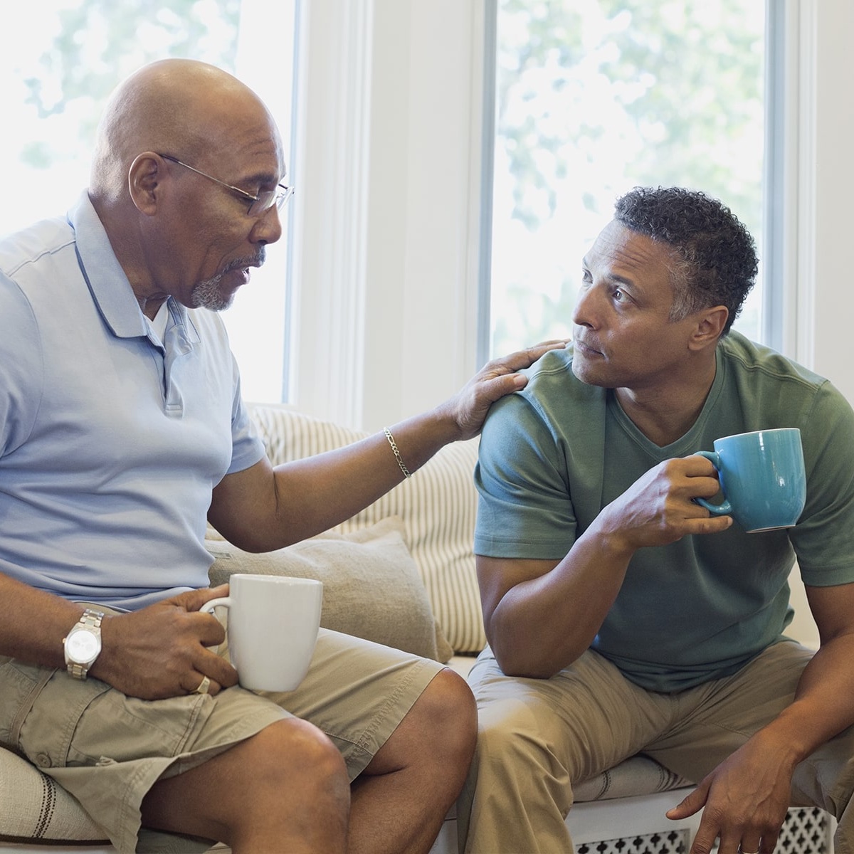 two men drinking coffee