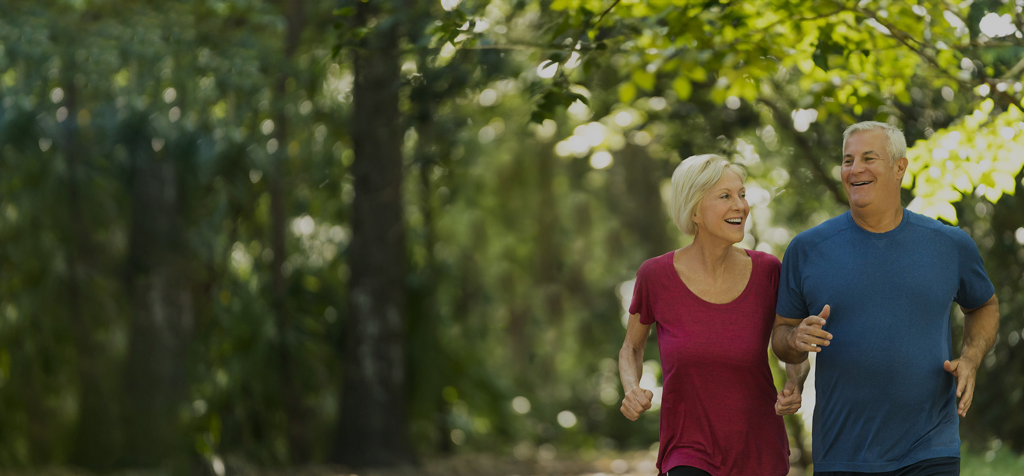 Woman and Man jogging in park.