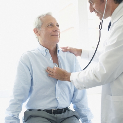 Man having lungs checked by a physician.